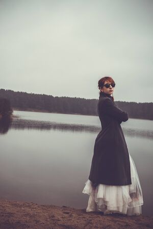 unusual woman in long skirt as a concept outdoorsの写真素材
