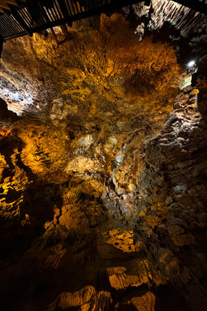 Cave wall with light, interior of the beautiful cave, abstract background and texture, stalactites...