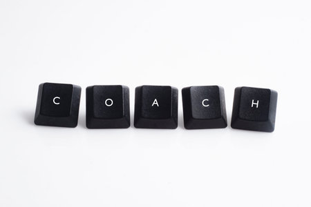 Coach word on black cube with white background