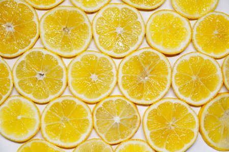Abstract photo of a yellow lemon fruit, top down.の写真素材