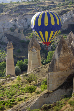 GOREME, TURKEY - June 13, 2014: Hot air balloon fly over Cappadocia in Goreme, Cappadocia, Turkeyのeditorial素材