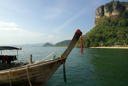 KRABI PROVINCE, THAILAND - January 09, 2014: Traditional Thai boat on Ao Nang beachのeditorial素材
