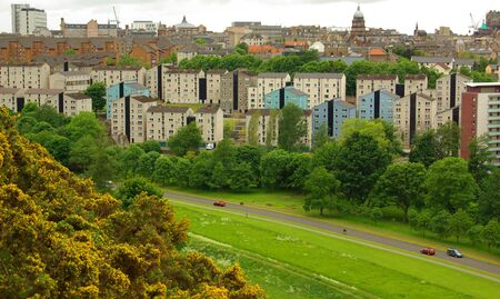 EDINBURG, SCOTLAND - June, 2013: Edinburgh city and mountain viewed from the hillのeditorial素材
