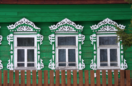 YAROSLAVL REGION, RUSSIA - MARCH, 2016: The facade of the old wooden houses with carved architravesのeditorial素材