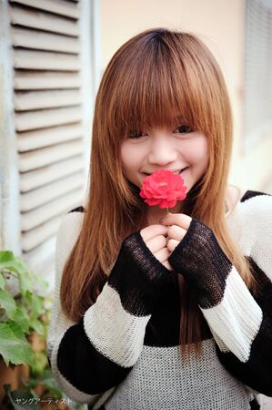 Asian girl in a gardenの写真素材