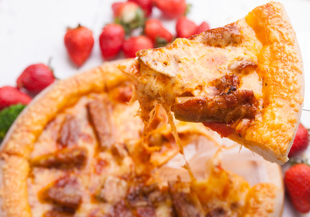 Pizza on the white tableの写真素材