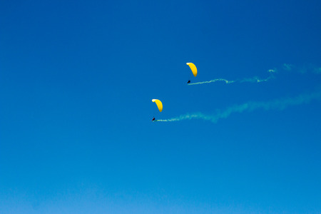 Parachute flight, air skydive, smoke bombの写真素材