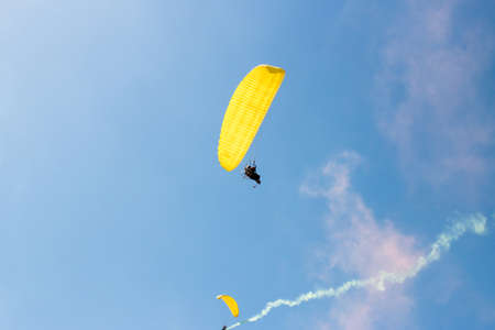 Parachute flight, air skydive, smoke bombの写真素材