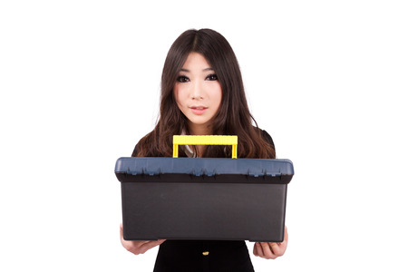 A Chinese girl holding a toolboxの写真素材