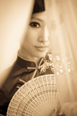 Woman wearing a cheongsam, Chinese classical costumesの写真素材