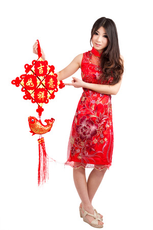 Chinese pretty girl wearing cheongsam holding chinese new year decorationの写真素材