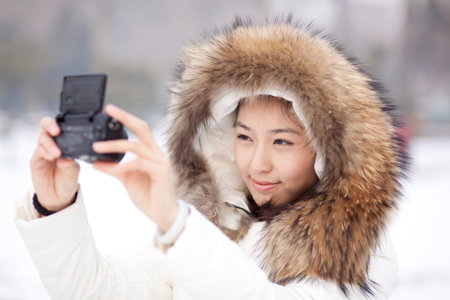 A pretty chinese girl taking self potrait