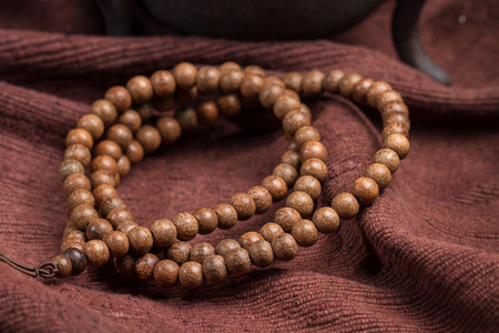 Buddhist beads, placed on the linoleum.の写真素材