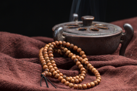 Buddhist beads, placed on the linoleum.の写真素材