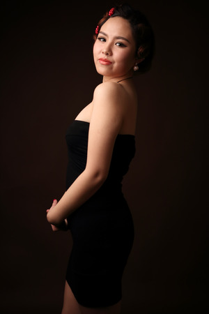 Asian girl dressed in black eveningの写真素材