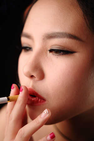 Asian girl dressed in black eveningの写真素材