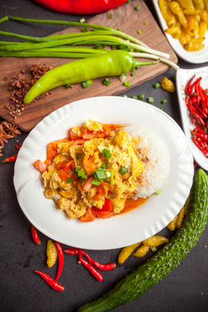 rice served with meat and vegetables on topの写真素材