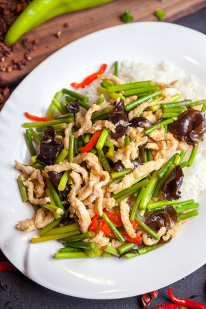 rice served with meat and vegetables on topの写真素材