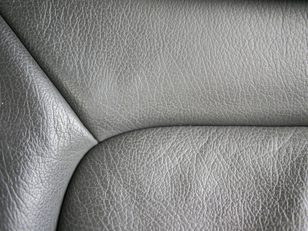 Leather texture of car's seat inside modern car with beautiful closeup, rough and gray skin include  tailoring line of leather in luxury way. Good for background and backdrop etc.の写真素材