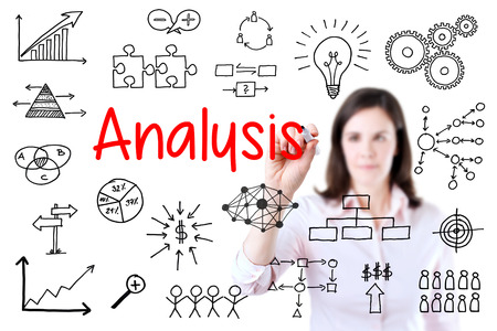 Young business woman writing data analysis. Isolated on white background.の写真素材