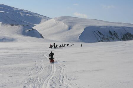 people crossing snow, Svalbard Norwayの写真素材