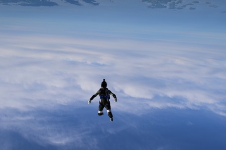 Skydiving over beautiful Norway. Clouds, sun and skyの写真素材