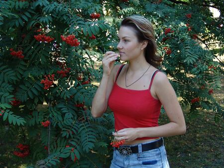 The girl with a mountain ashの写真素材