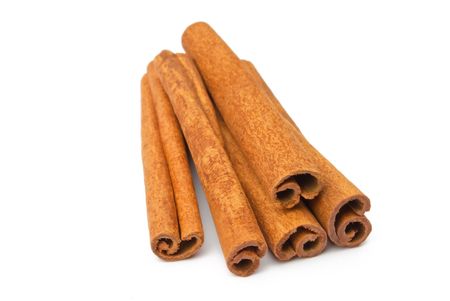 Cinnamon sticks isolated on whiteの写真素材