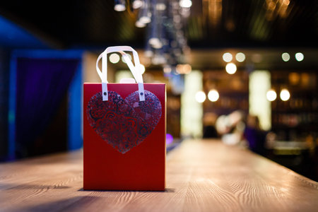 Valentine's day background with shopping bag and heart shapeの写真素材