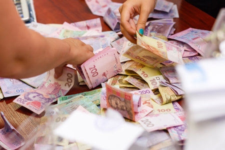 Ukrainian money hryvnia. The national currency. Pile of bancknotes on the tableの写真素材