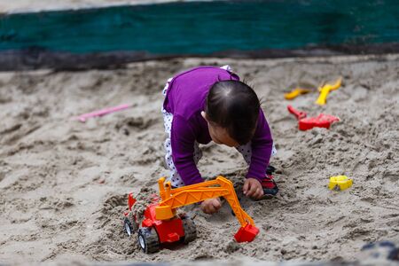 Child on playground in summer parkの写真素材
