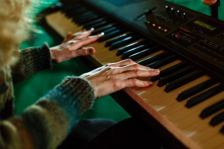 woman playing on electric piano pianist musicの写真素材