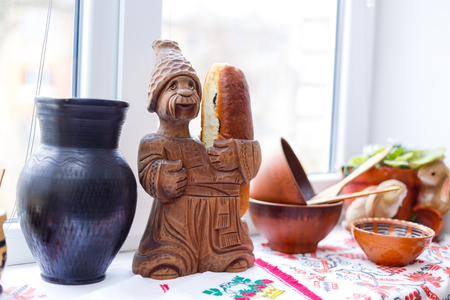 Ukrainian man and woman figurine handmade from clay selective focusの写真素材