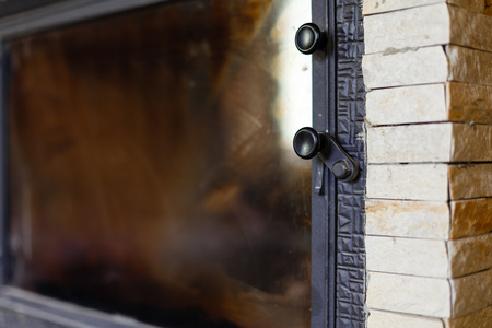 the fire behind a closed glass doorの写真素材