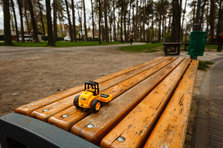 Wooden toy car on a wooden bench