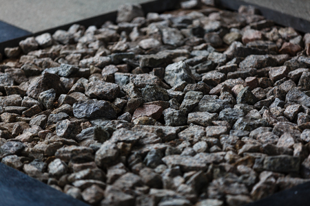 Stone background, stones. Stones pattern. Crushed stones texture. Stones construction rocks. Top view. Background for interior, exterior or industrial construction concept design. Space for text.の写真素材
