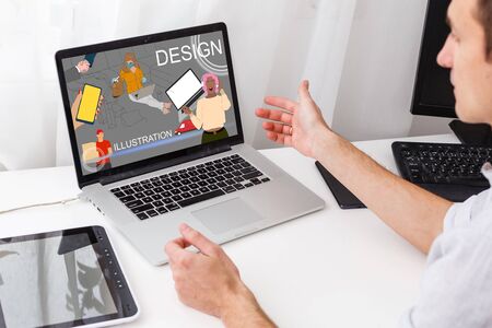 handsome hipster modern man designer working home using laptop at homeの写真素材