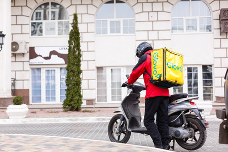 Delivery man and motorcycle,Transportation Conceptのeditorial素材