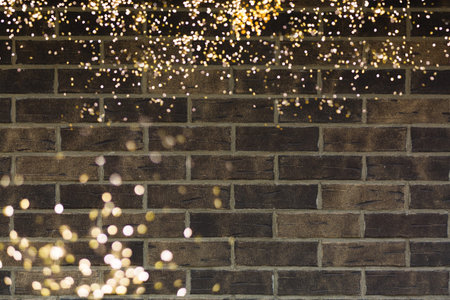 Beautiful bokeh light with brick wall background.