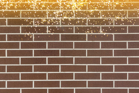 Beautiful bokeh light with brick wall background.の写真素材