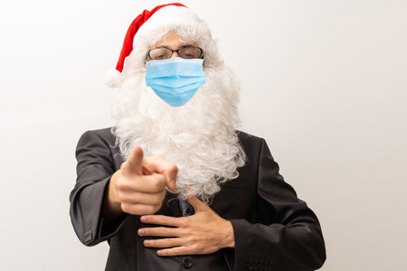 Hello kids. Closeup photo old bearded happy santa talk children remote internet online facial webcam view work wear respirator mask headwear shirt suspenders isolated red backgroundの写真素材