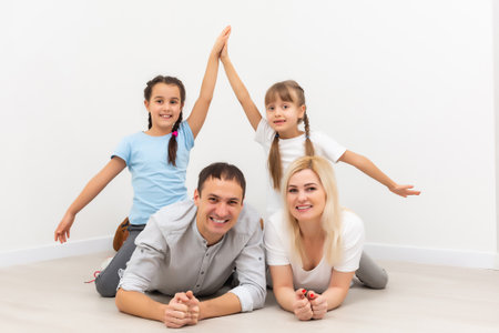 Portrait of a happy family smiling at homeの写真素材