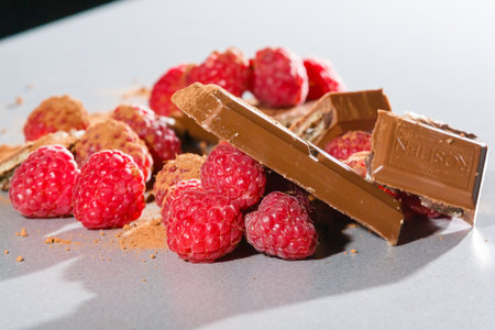 raspberries with chocolate on gray background chocolateの写真素材
