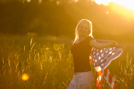 Beautiful Young Woman with USA Flagの写真素材