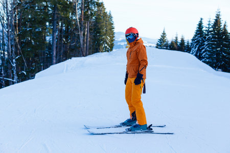 Skiing with face mask. winter vacation in pandemia. Portrait of caucasian young man with face mask. Winter is coming in new reality.の写真素材