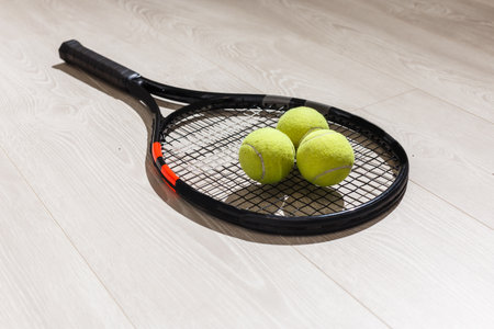 Tennis iquipment against a wooden backgroundの写真素材