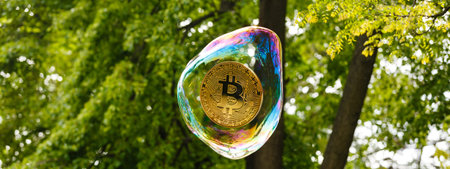 Bitcoin Coin In A Soap Bubble. Concept Of Instability Of The Crypto Currency.