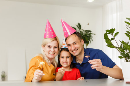 Big family celebrates birthday online. Mom dad kids at home laptop video call self-isolation. Party new technology gadgets. Coronavirus quarantined.の写真素材