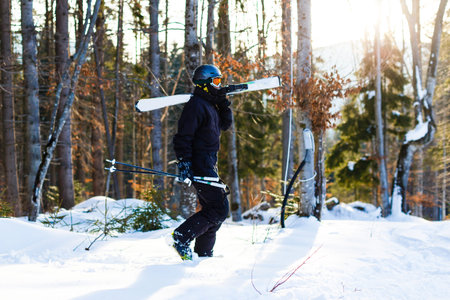 skier looking at snow covered mountains