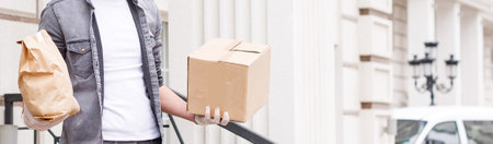 food delivery man in protective maskの写真素材